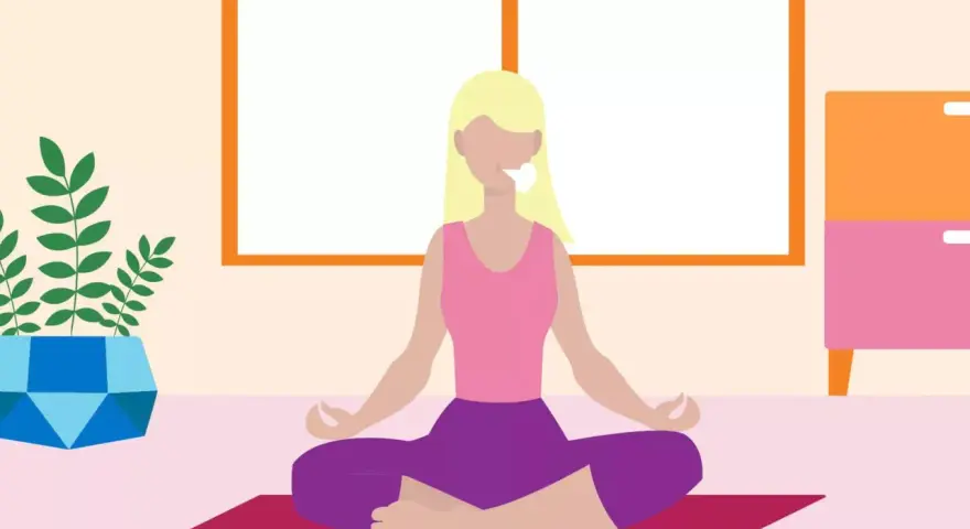 A woman meditates, breathing deeply to relax mind and body.