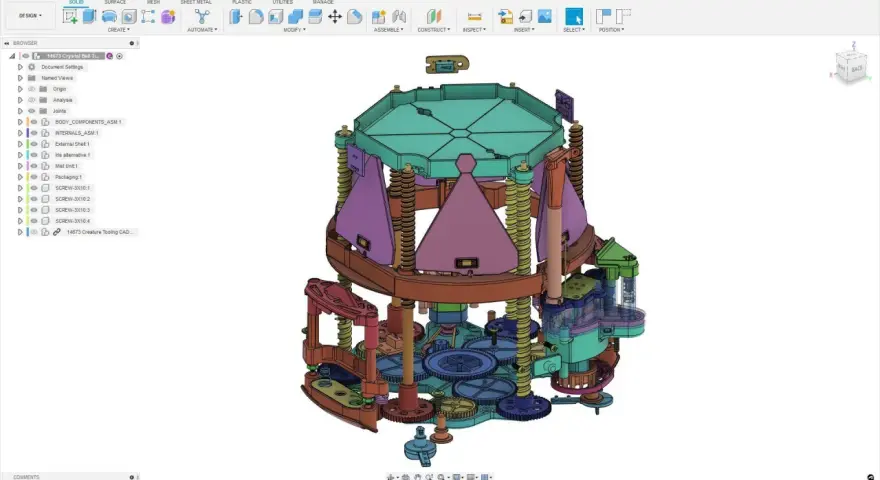 Złożony mechanizm zębatek i elementów, stworzony w programie Autodesk 123d, przypomina skomplikowany zegar lub urządzenie.