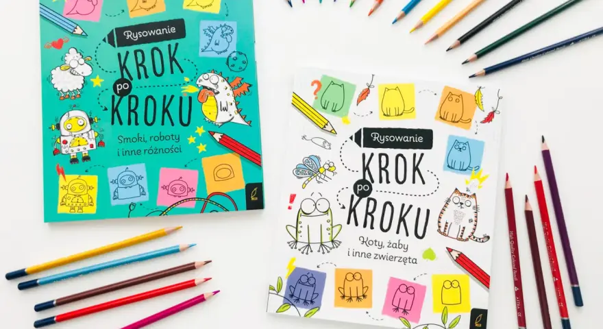 Dwie książki "Rysowanie Krok po Kroku" zachęcają do nauki rysowania smoków, robotów i zwierząt. Kolorowe kredki leżą obok, gotowe do tworzenia.