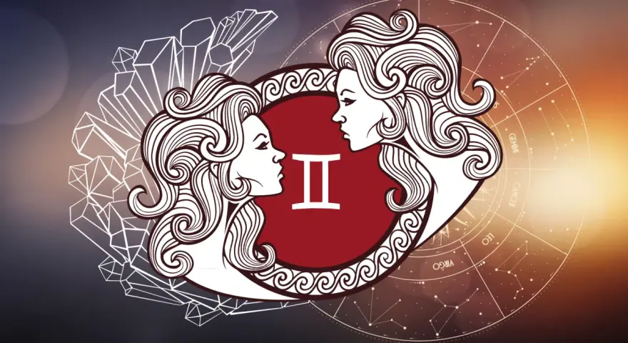 Symbol Bliźniąt z dwoma profilami twarzy, otoczony kryształami i kołem zodiaku. Horoskop bliźnięta miłosny.
