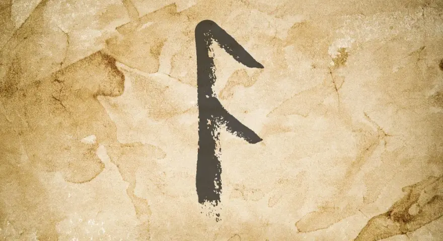 Runa Fehu, symbol bogactwa i powodzenia, namalowana na postarzanym papierze.