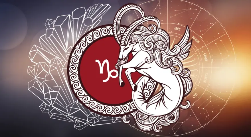 Symbol koziorożca, mityczne stworzenie z rybim ogonem i skrzydłami, na tle kryształów i koła zodiaku.