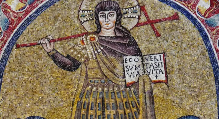 Mozaika przedstawia postać z krzyżem i księgą, symbolizującą boga.