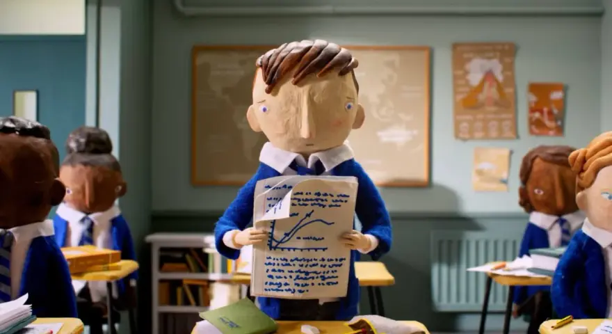 Bambini in aula con un foglio che mostra un grafico. Il cortometraggio significato è la difficoltà di apprendimento.