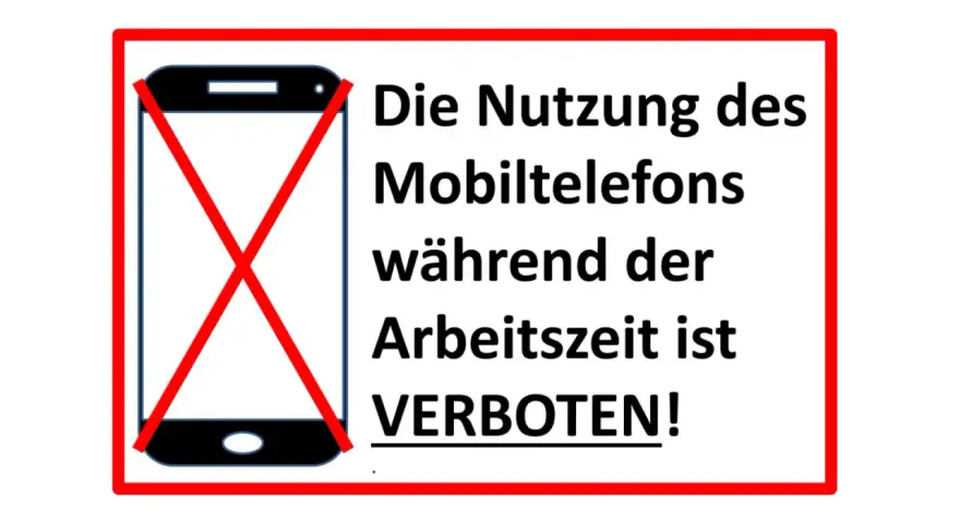 Handyverbot am Arbeitsplatz: Ein Smartphone mit rotem Kreuz zeigt an, dass die Nutzung während der Arbeitszeit untersagt ist.