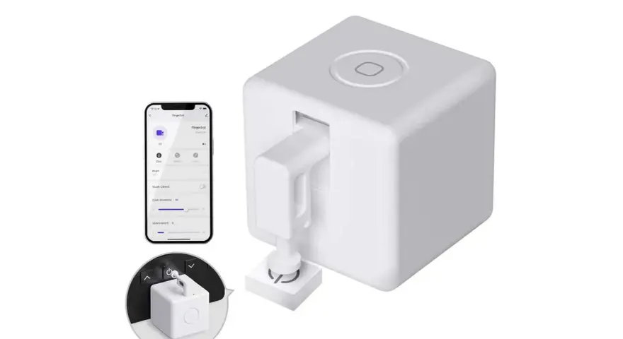 A white cube-shaped device with a robotic arm, paired with a smartphone app, showcasing cool IoT devices for smart home automation.