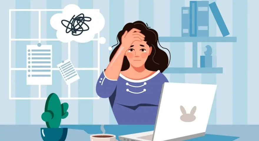 Mujer agobiada por papeleo y estrés laboral, pensando en una impugnación alta médica y reincorporación al trabajo.