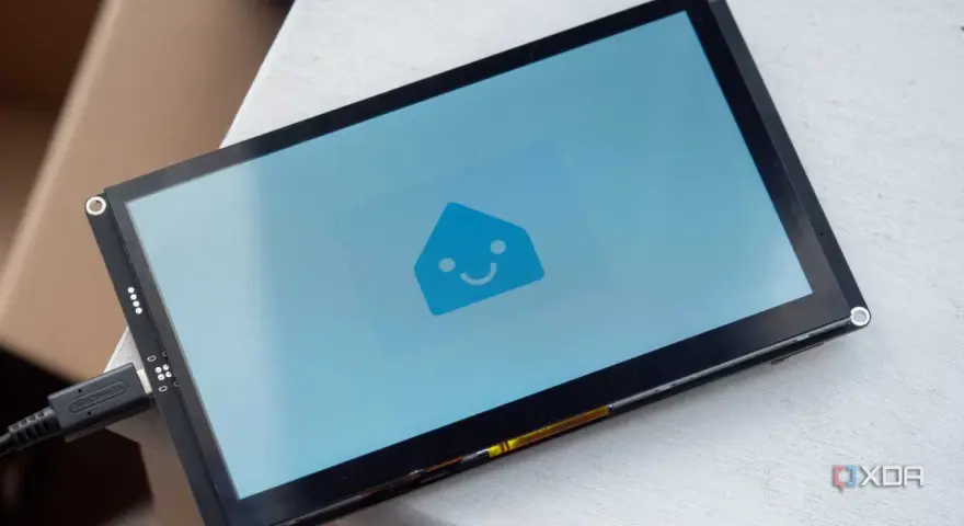 A screen displays the Home Assistant logo, ready for ESPHome Zigbee integration.