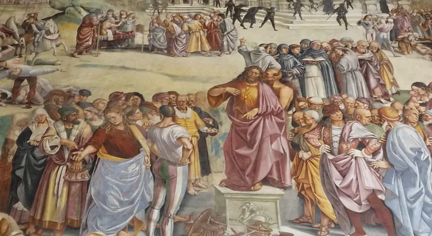Tłum otacza Jezusa, który przemawia. Wśród tłumu widać ludzi w barwnych strojach, mnichów i żołnierzy. Czy to heretyk, kto to?
