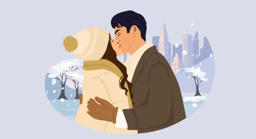 Pareja besándose en un paisaje nevado, con edificios al fondo. Él le susurra apodos cariñosos en francés.