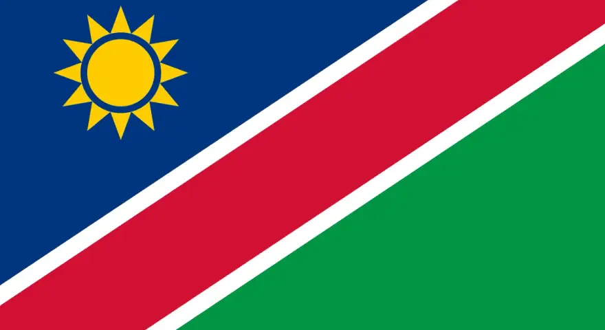 Flaga Namibii z żółtym słońcem. Marzysz o podróży? Sprawdź, czy potrzebna jest namibia wiza.