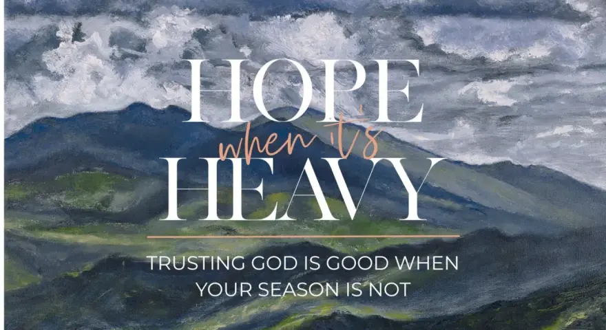 Hope when it's heavy. Trusting God is good when your season is not. A painted mountain landscape under stormy skies.