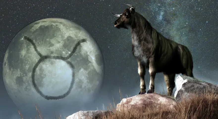 Byk na tle księżyca z symbolem zodiaku. Jego ascendent w byku zapowiada siłę i stabilność.