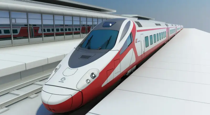 Nowoczesny, biało-czerwony pociąg Pendolino na peronie dworca.
