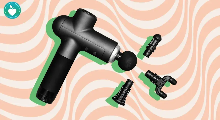 Black massage gun with interchangeable heads, hinting at the massage gun benefits study.