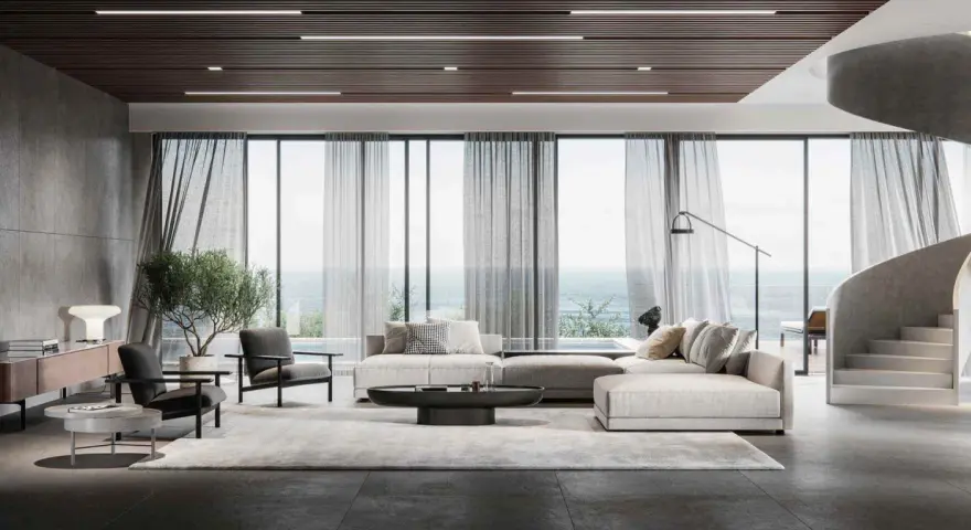 Soggiorno moderno con divano componibile, poltrone, tavolino e vista mare. L'arredamento evoca l'eleganza delle case stile americano, con linee pulite e materiali pregiati.