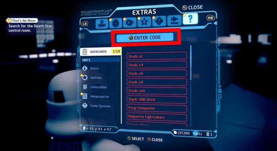 Pantalla de extras en LEGO Star Wars: The Skywalker Saga. Se muestra la opción "ENTER CODE" para introducir códigos.