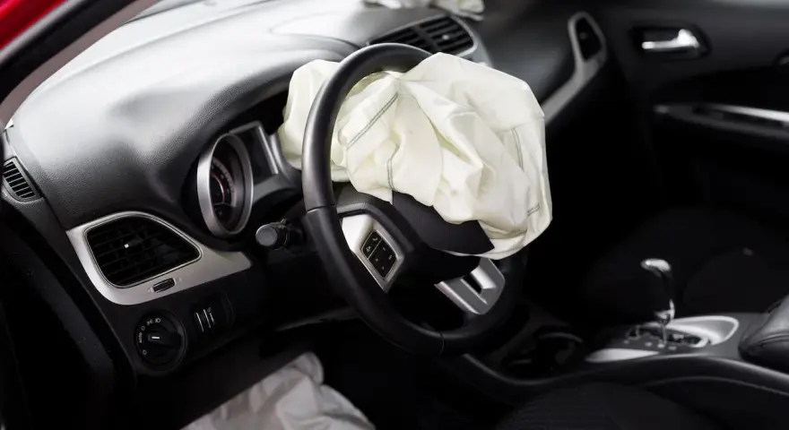 The driver's side airbag has deployed. This image raises the question: can airbags be replaced after an accident?