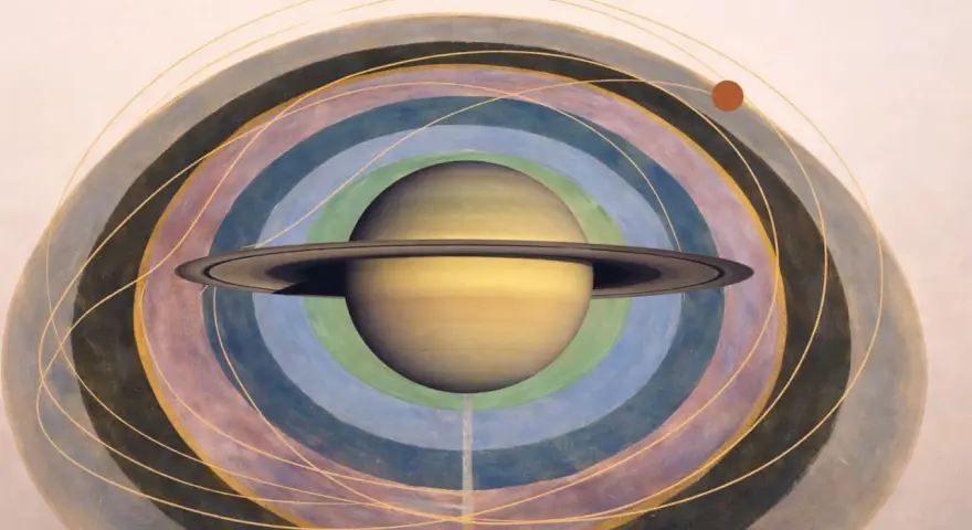 Saturno en astrología, representado con sus anillos, rodeado de órbitas concéntricas de colores y líneas doradas.