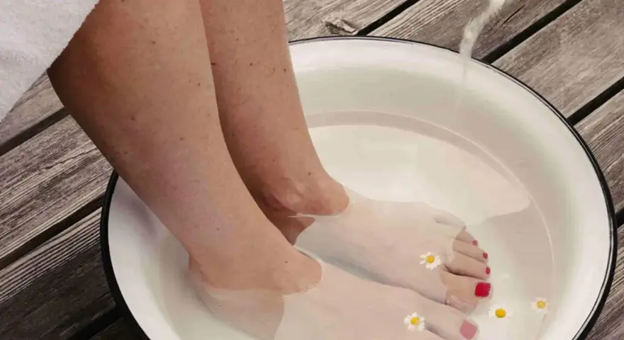 A relaxing foot soak with Epsom salts and chamomile flowers. Discover what to soak feet in for detox and rejuvenation.