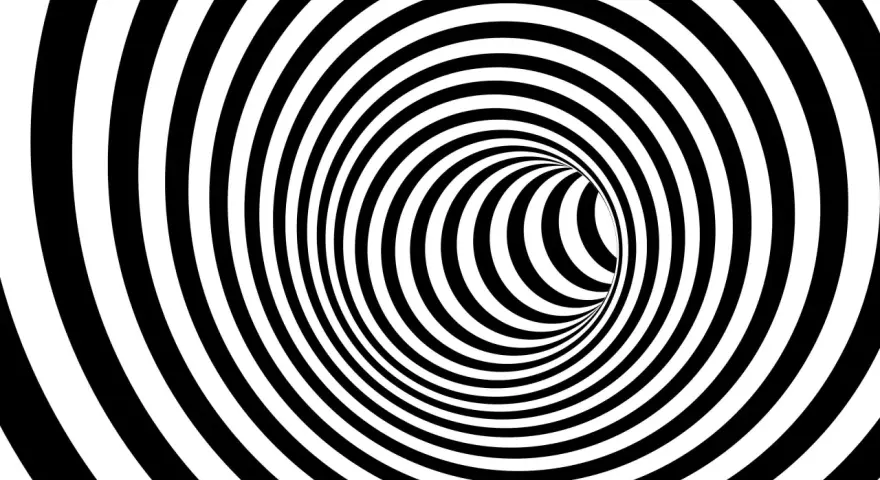 En svartvit tunnel med spiralmönster som kan ge känslan av ångest tankar.