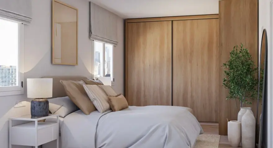 Acogedor dormitorio estilo escandinavo con cama, mesita de noche, armario de madera y planta decorativa.