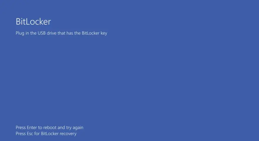 Ekran BitLocker: podłącz USB z kluczem BitLocker. Naciśnij Enter, by zrestartować, lub Esc, by odzyskać dostęp.