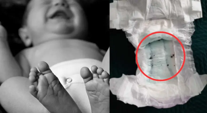 Jak założyć pampersa chłopcu? Zdjęcie pokazuje stopy dziecka i zużytą pieluchę z zielonym wkładem i ciemnymi grudkami.