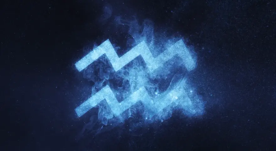 Błękitny symbol Wodnika, znaku zodiaku 6 lutego, lśni na tle nocnego nieba pełnego gwiazd.