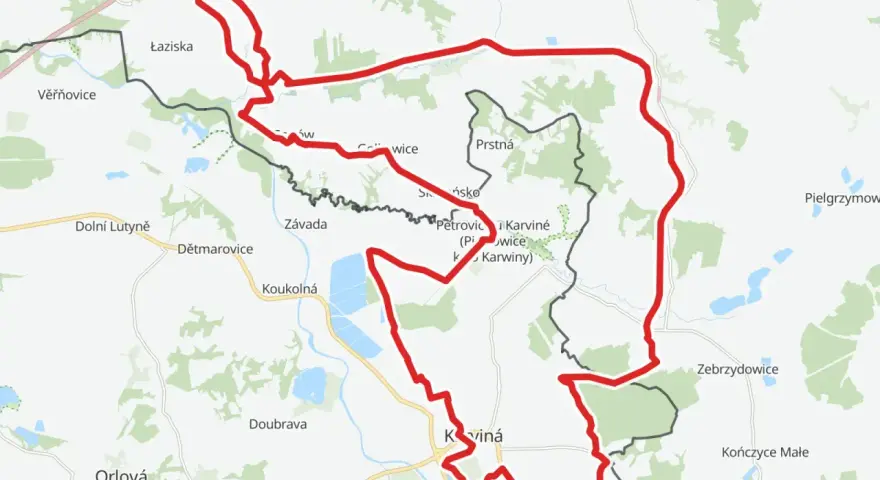 Mapa z zaznaczonym czerwonym szlakiem rowerowym, biegnącym przez tereny z nazwami miejscowości jak Łaziska, Karviná i Jastrzębie-Zdrój.