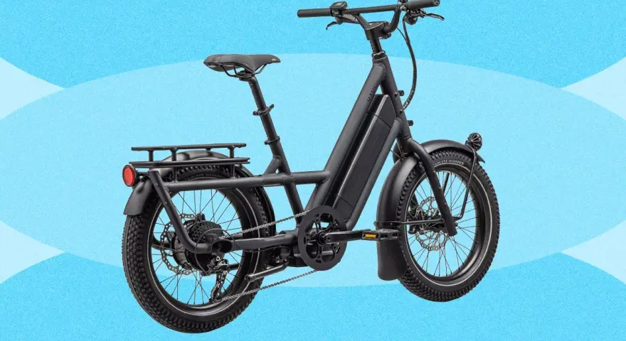 A black electric cargo bike with a long frame and rear rack, perfect for hauling groceries or kids.