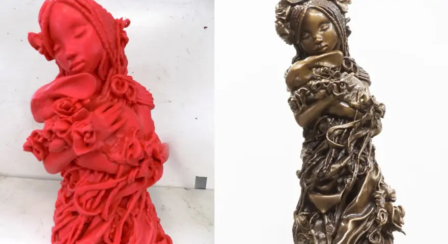 A red 3D printed model of a girl holding flowers, ready for casting, compared to the finished bronze sculpture.