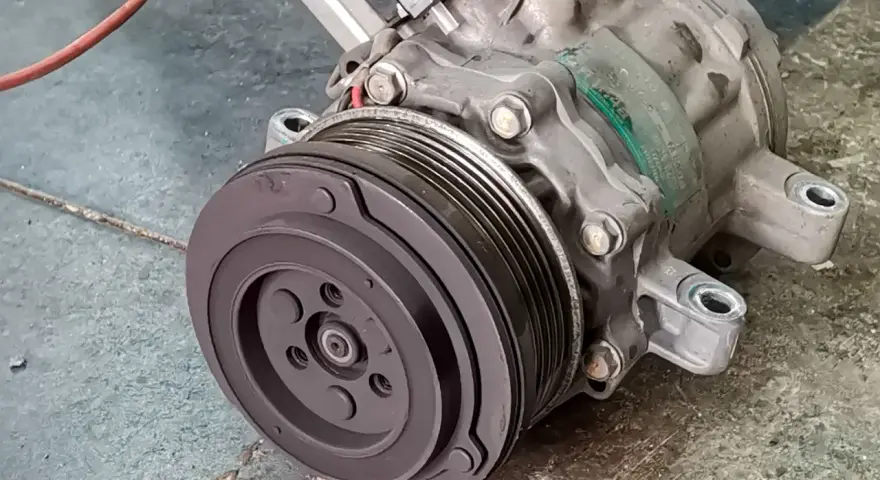 A car's AC compressor, a key component for cool air. Considering the ac compressor replacement cost? This part is vital for your comfort.