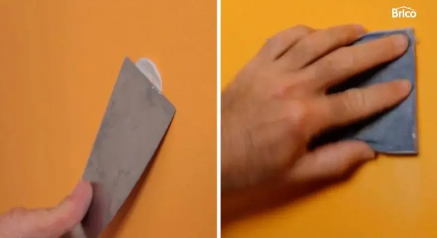 Herramienta para quitar tacos de la pared y mano lijando.