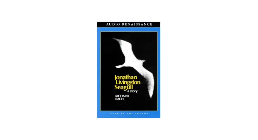 Audiobokomslag för "Jonathan Livingston Seagull" av Richard Bach, med en vit mås mot svart bakgrund.