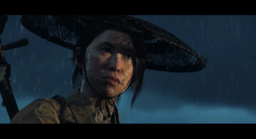 Młoda kobieta w deszczu, z błotem na twarzy, w tradycyjnym stroju i kapeluszu. Czy to zapowiedź Ghost of Tsushima 2?