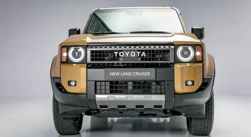 Nowy Land Cruiser Prado w złotym kolorze, z charakterystycznym grillem i okrągłymi światłami.