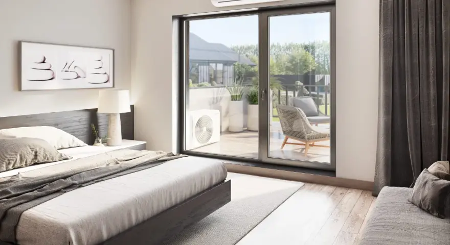 Unidad exterior de aire acondicionado visible a través de la puerta corredera, con una cama y arte de pared en la habitación.