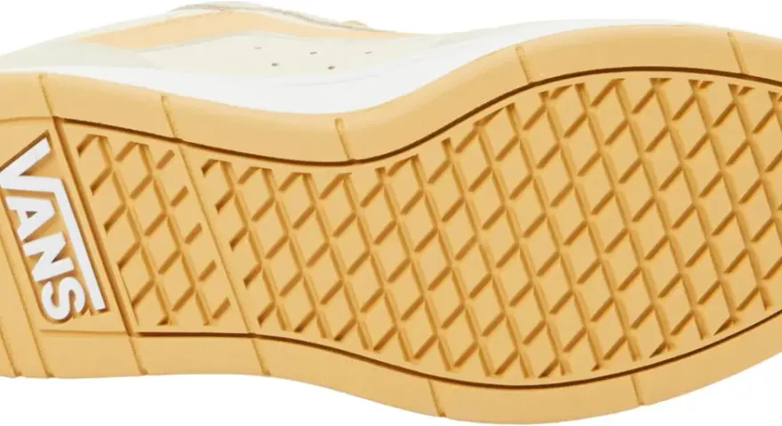 Suela de zapatilla Vans con patrón de rombos y logo blanco. Ideal para tu guía de tallas Vans.