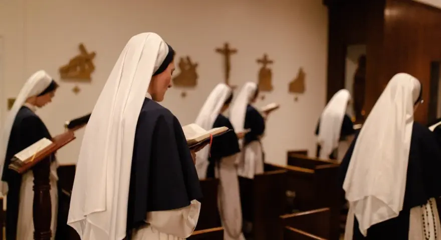 Nuns in a chapel reading from books. This scene offers a glimpse into how to join a monastery female, showcasing devotion and study.