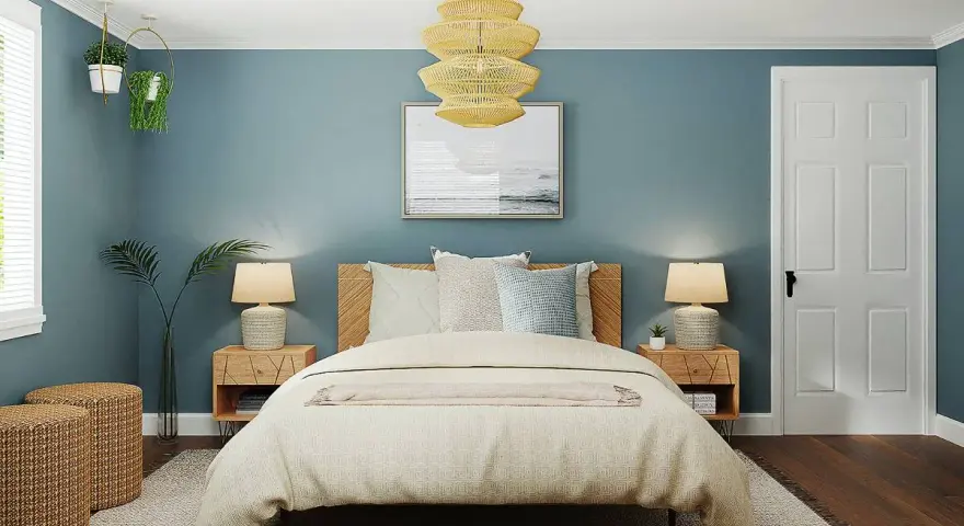 Habitación con paredes azul petróleo, cama acogedora y detalles en madera. Ideas de colores para habitaciones que inspiran calma y serenidad.