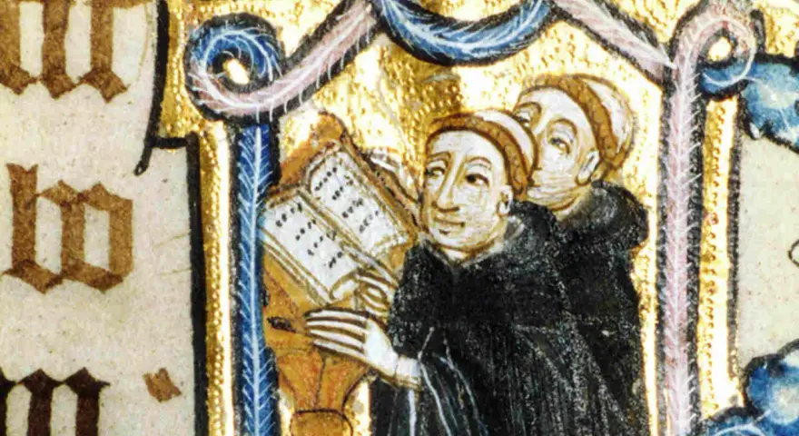 Illuminated manuscript shows Benedictine monks studying a book, illustrating how Benedictine monks spent their time in prayer and learning.