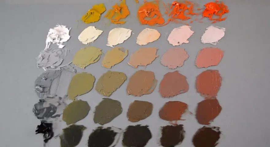 Paleta Zorn con tonos tierra, ocres, naranjas y grises, dispuesta en filas sobre fondo gris.