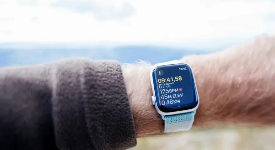 An Apple Watch displays cycling metrics, including time, calories, heart rate, elevation, and distance. It's a great tool for tracking your VO2 max during outdoor activities.