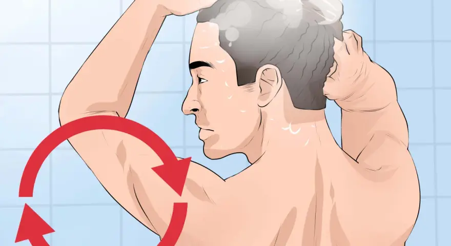 Hombre lavándose el cabello en la ducha, con un círculo rojo indicando un movimiento repetitivo, como si fuera un grano interno que necesita atención.