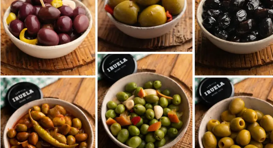 Miseczki pełne oliwek: ciemne, zielone, marynowane. Oliwki zielone z czosnkiem i papryczką, idealne do tapas.