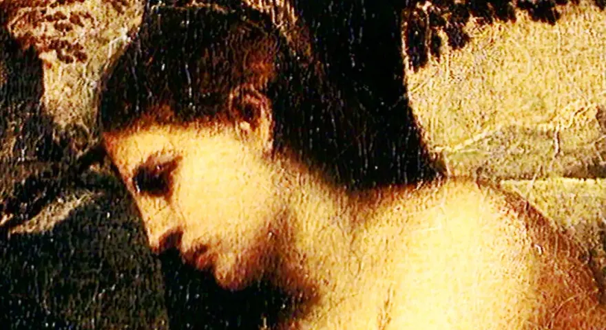 Détail du Concert champêtre titien : profil d'une femme aux cheveux sombres, baignée de lumière, dans une scène pastorale.