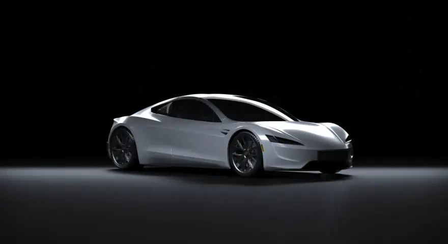 Srebrny Tesla Roadster na czarnym tle. Zastanawiasz się, ile kosztuje Tesla?