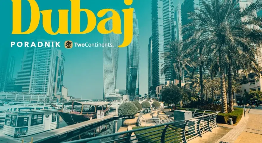 Dubaj: czy do Dubaju trzeba paszport? Widok na nowoczesne drapacze chmur, palmy i przystań z łodziami.