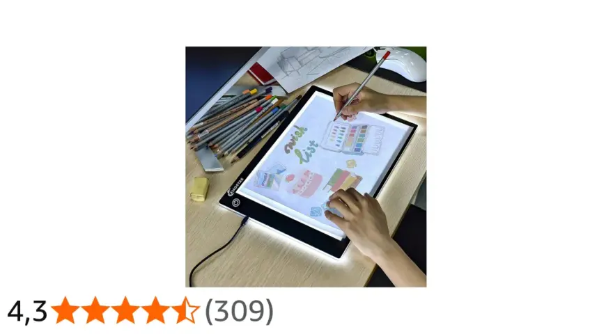 En person använder ett ljusbord för att rita en "wish list" med färgpennor och akvareller.